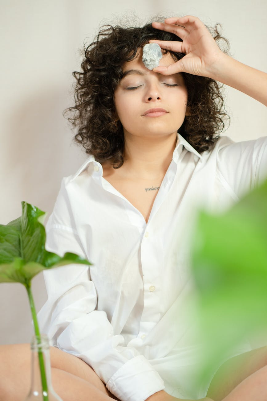 Person in a state of calm meditation with neon lime energy.